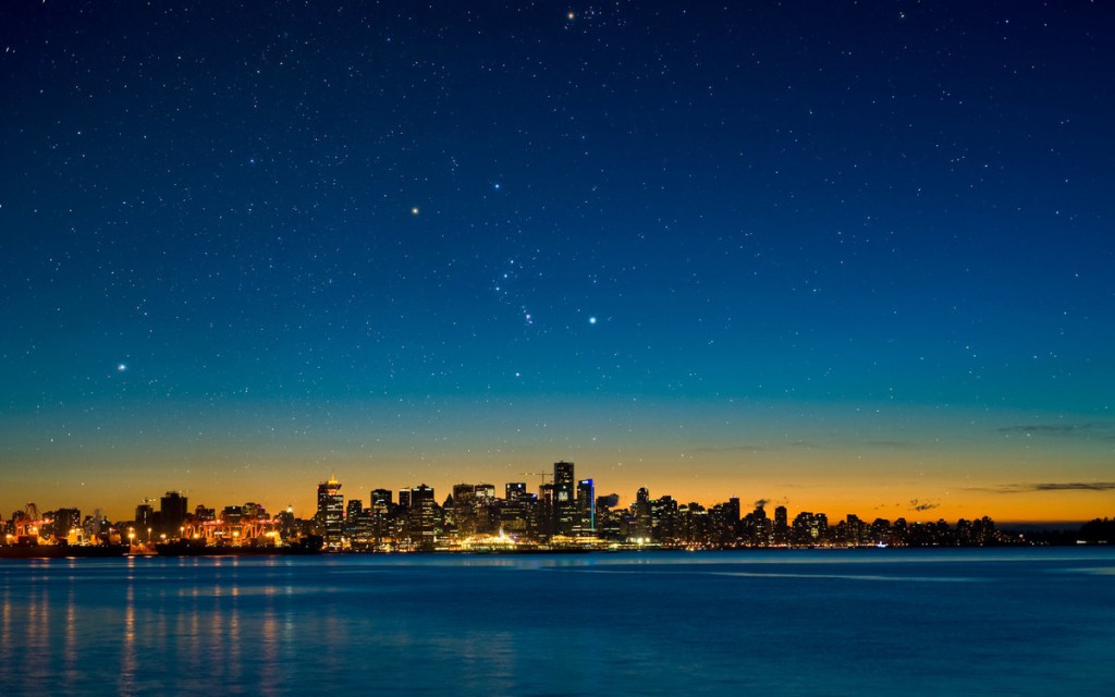 Очертания крупных городов мира на фоне ночного неба