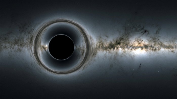 Если фотон не имеет массы, почему черная дыра затягивает свет