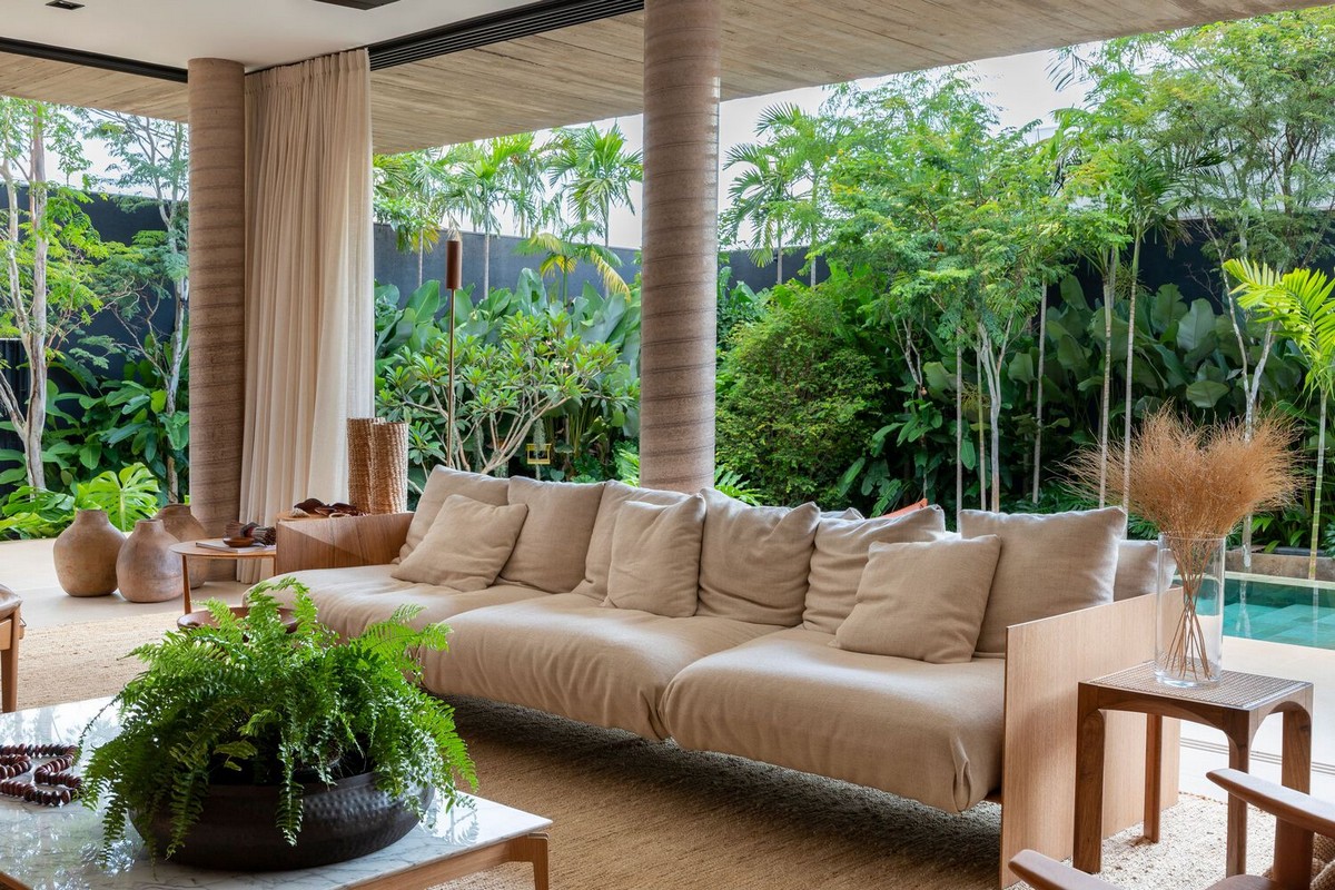 Вилла со стильным современным дизайном в Бразилии террасы, материалов, впечатляет, открытого, отдыха, ландшафту, гостиной, этажа, полностью, дизайном, стильным, современным, экраны, натуральных, качестве, Бразилии, Уютом, стирают, открытые, оборудованной
