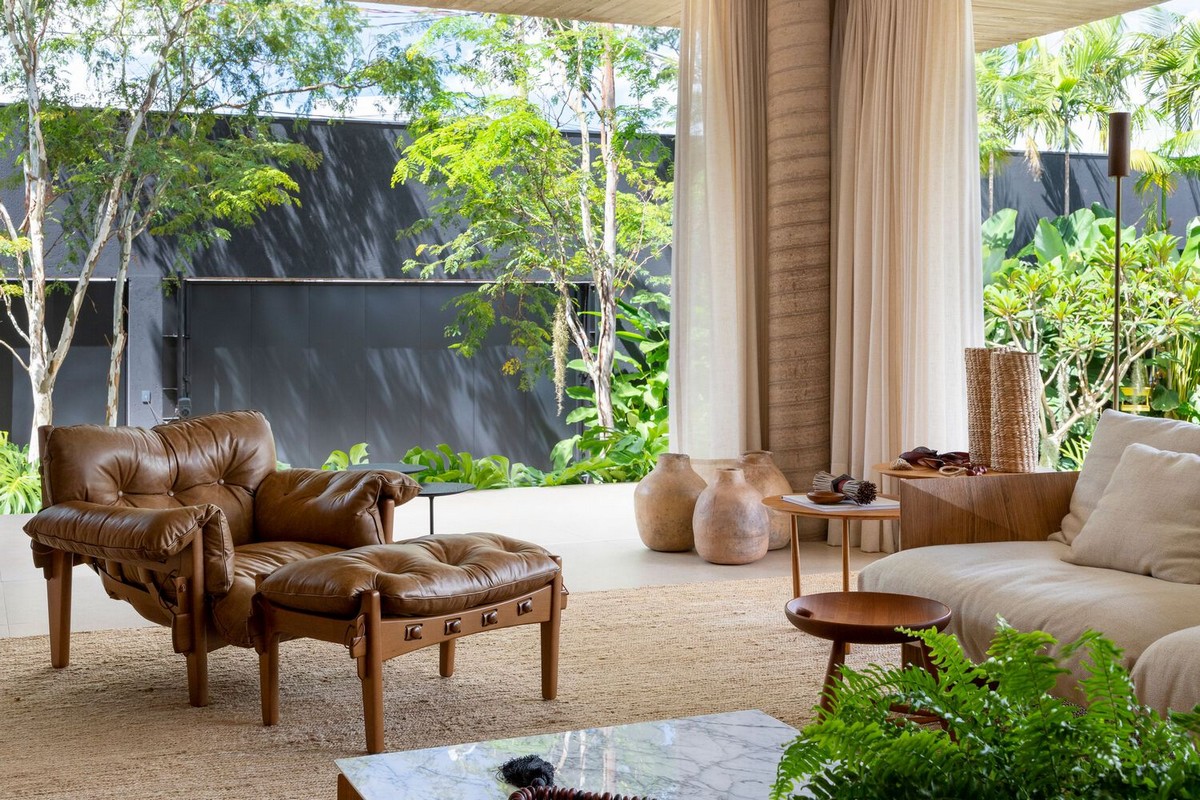 Вилла со стильным современным дизайном в Бразилии террасы, материалов, впечатляет, открытого, отдыха, ландшафту, гостиной, этажа, полностью, дизайном, стильным, современным, экраны, натуральных, качестве, Бразилии, Уютом, стирают, открытые, оборудованной