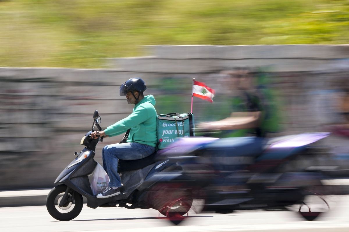 Woman Kickstart on Moped